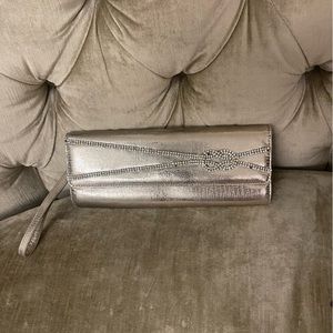 Aldo gold clutch, like 6 stones missing, see pictures
